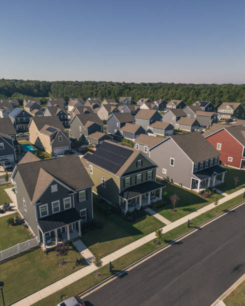 istock Green House with Solar Panels - Modern Middle Class Neighborhood - Dense Population - Vertical - Wide Angle 2176228232
