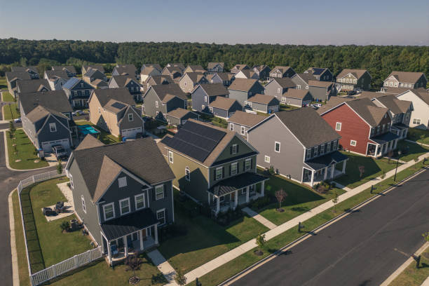 istock Green House with Solar Panels - Modern Middle Class Neighborhood - Dense Population - Wide Angle 2176228253