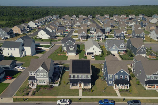 istock House with Solar Panels - Row - Modern Middle Class Neighborhood - Dense Population 2176228298