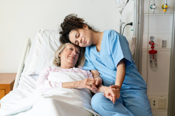 istock Nurse providing emotional care to elderly patient 2176228372