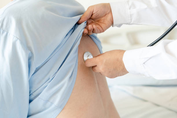 istock Doctor checking senior patient with stethoscope in hospital 2176228375