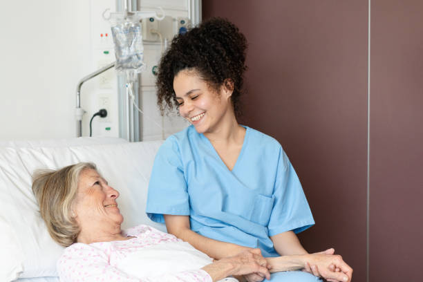 istock Nurse offering support to senior patient in hospital 2176228378