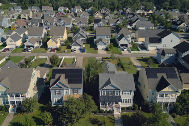 istock Solar Houses - Modern Middle Class Neighborhood - Dense Population - High Angle Front 2176228434