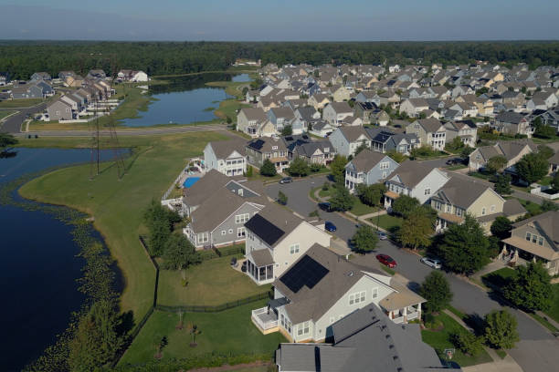 istock Solar Houses in a Massive Modern Middle Class Neighborhood - Dense Population - Lake 2176228450
