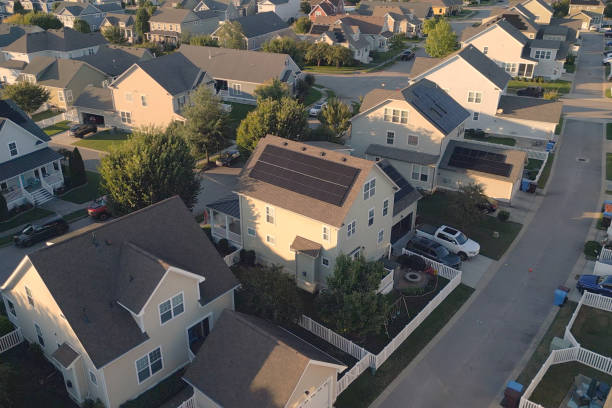 istock Yellow House with Solar Panels  - Modern Middle Class Neighborhood - Dense Population 2176228568