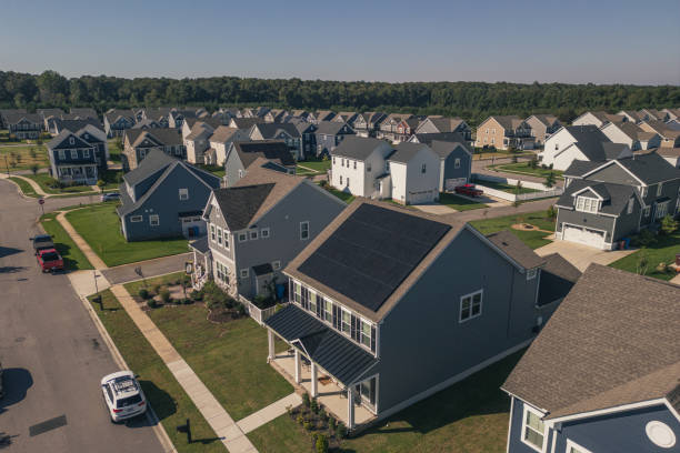 istock Blue House with Solar Panels - Modern Middle Class Neighborhood - Dense Population - Wide Angle 2176228722