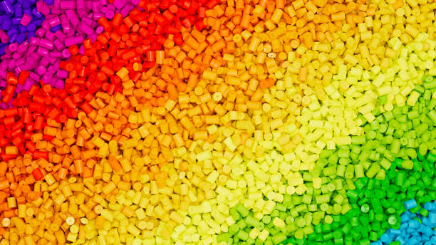 istock Closeup top view on piles of colorful rainbow polypropylene granules, masterbatch polymer grain rows. HDPE or PVC resin pellets. 3d render illustration 2176229576