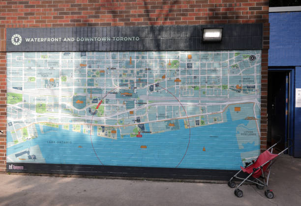 Toronto, Canada - August 27, 2024: A street map outside a Harbourfront public restroom building illustrates the Waterfront community and downtown district lining Lake Ontario. Summer morning near the Jack Layton Ferry Terminal at the Inner Harbour of Lake Ontario.