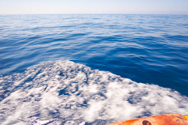 istock Sailing across a blue calm and quiet Mediterranean Sea sea side view 2176235323