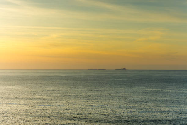 Sunset over the Flannon islands from the Isle of Lewis outer Hebrides Scotland.
