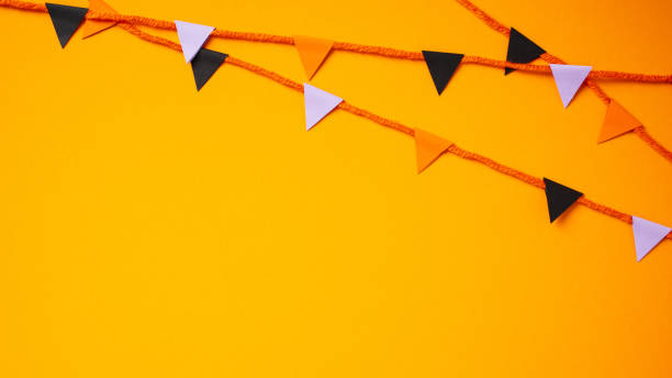 istock Banner with bunting flag garland for Halloween celebration on orange background. 2176237064