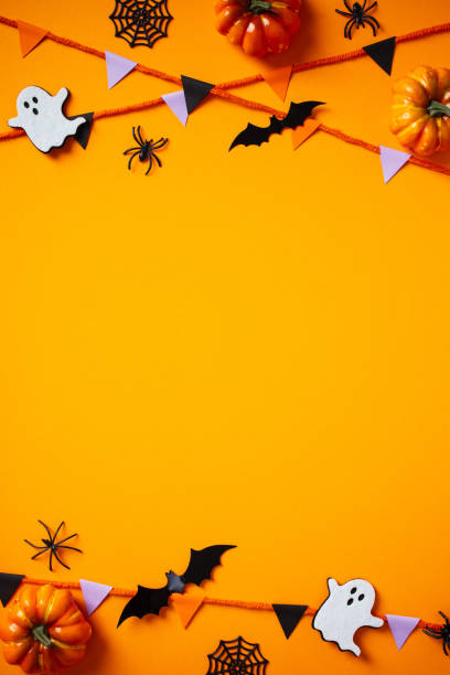 istock Halloween composition with cute bats, ghosts, pumpkins, spiders, bunting flag garland on orange background. Happy Halloween vertical banner mockup, poster design. Flat lay, top view, copy space. 2176238073