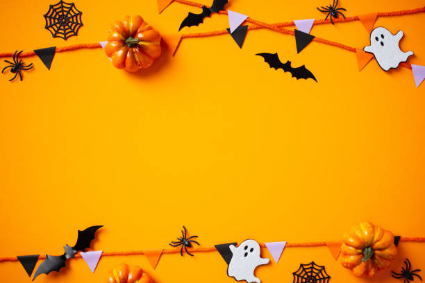 istock Halloween festive background featuring pumpkins, spiders, ghosts, bunting garland. Happy Halloween concept. 2176238111