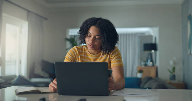 istock Smiling business woman using laptop 2176239834