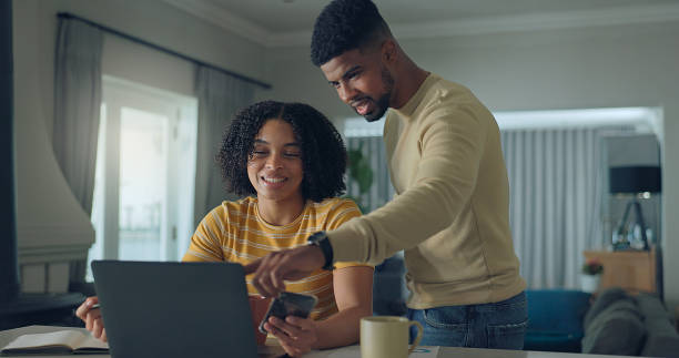 istock Positive young family do paper work paying utility bills 2176239877