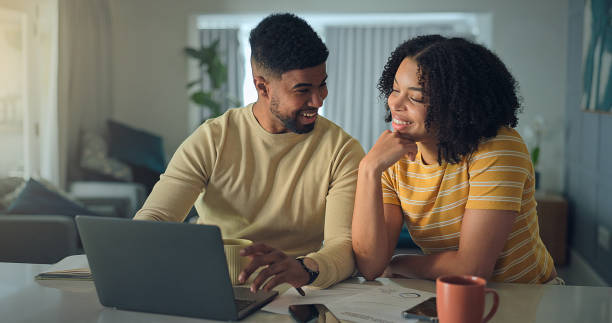 istock Positive young family do paper work paying utility bills 2176239885
