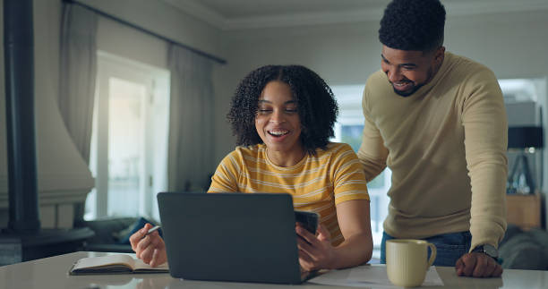 istock Positive young family do paper work paying utility bills 2176239894