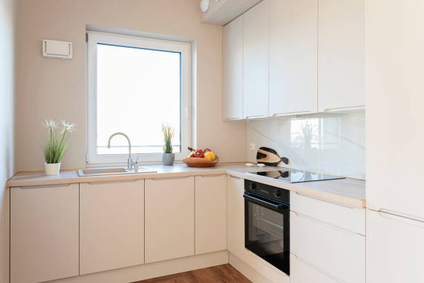 istock Kitchen interior with kitchen sink with water tap and kitchen worktop near window. Home decor in new apartment. 2176240961