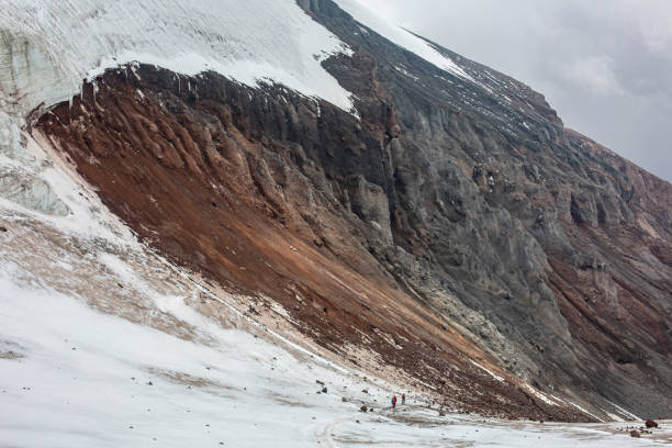 The interplay of ice and rock creates a harmonious composition of contrasting elements.