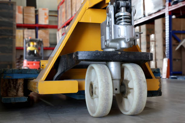 istock Pallet truck in warehouse 2176246042