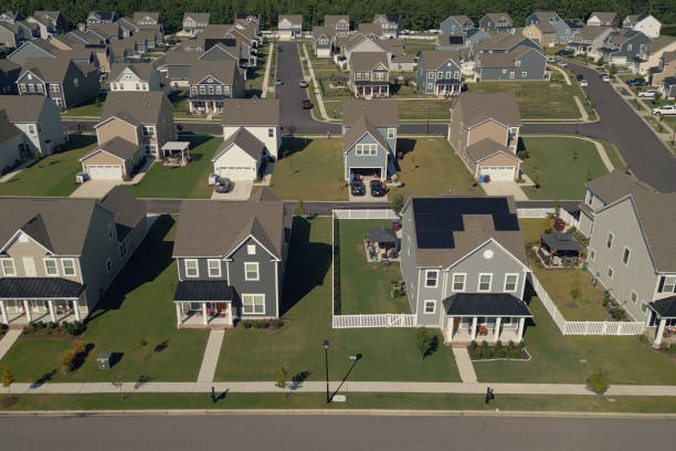istock House with Solar Panels - Row - Modern Middle Class Neighborhood - Dense Population 2176247500