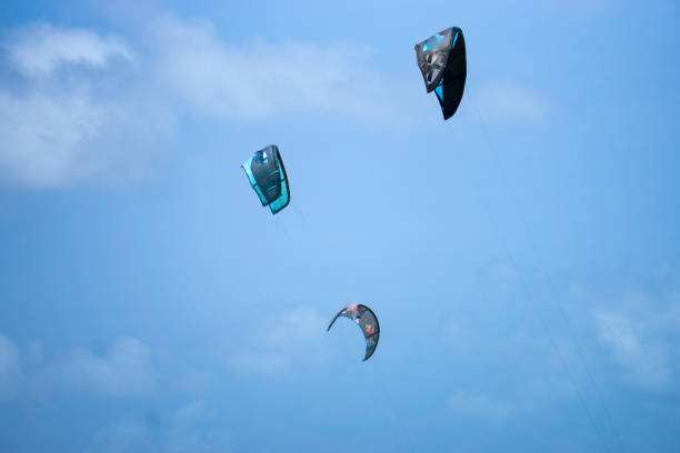 people kitesurfing on a windy day