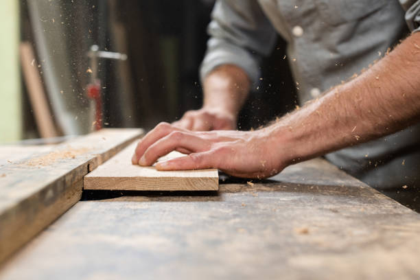 istock A carpenter mills an oak part with a milling cutter 2176252544