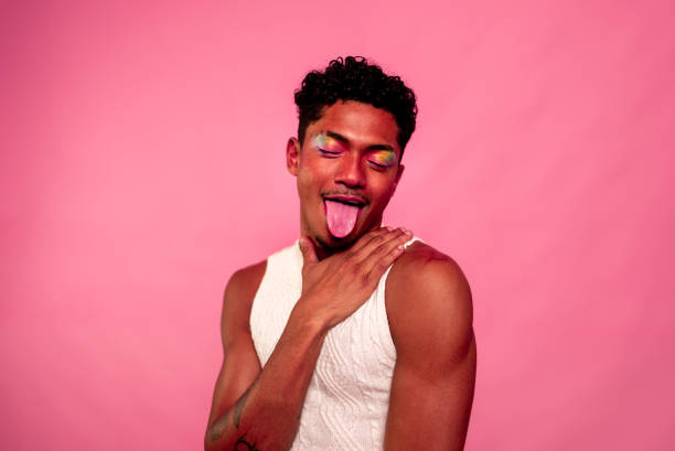 istock Young gay on pink background at studio shot 2176266941