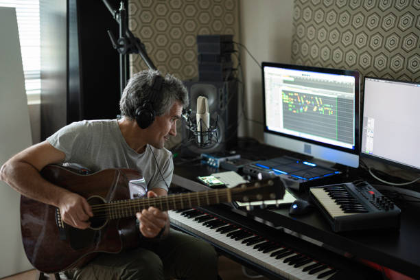 istock Musician Playing Acoustic Guitar In Home Music Studio 2176268182