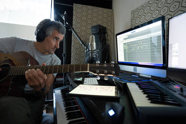 istock Musician Playing Acoustic Guitar In Home Music Studio 2176268194