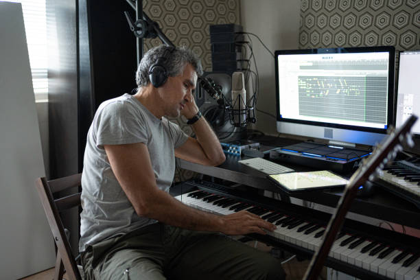 Musician Recording Piano Theme in Home Music Studio