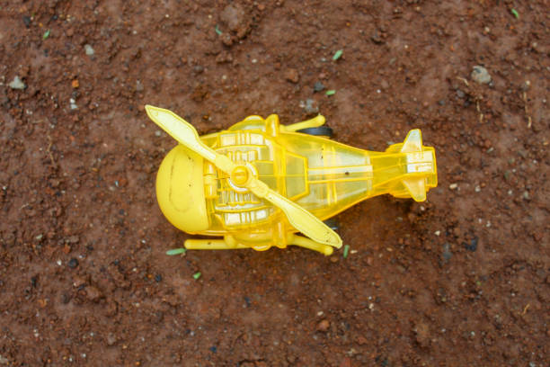 Air Crash. Burning falling helicopter. Destroyed helicopter. Decorated with toy at dark fire background