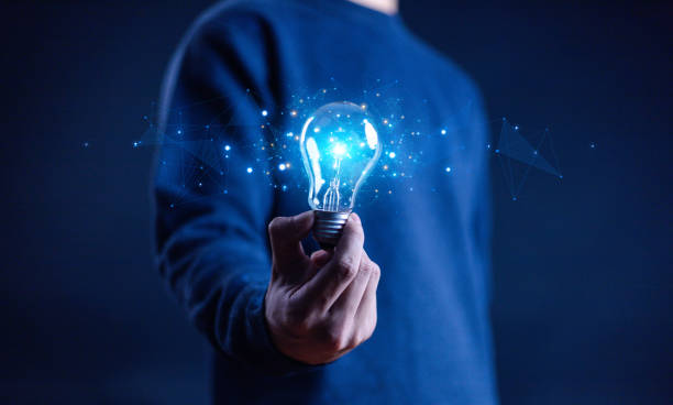 istock Innovation and inspiration concept. Businessman holding creative light bulb with industry and marketing development network icons. Strategic planning. Modern business and inspiration Idea innovation 2176296119