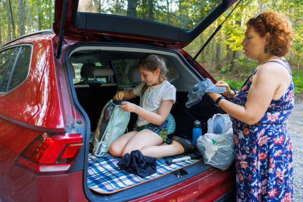 istock Weekend getaway unpacking in the state park's parking 2176297646