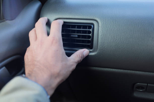 istock Hand adjust way of car air flow control hole at dashboard. 2176311548