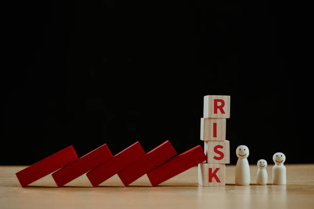 istock Risk management crisis analysis concept. Financial assessment solution, real estate loan business service. Insurance technology plan protect mortgage. Home safety family life, red wood domino block 2176313467