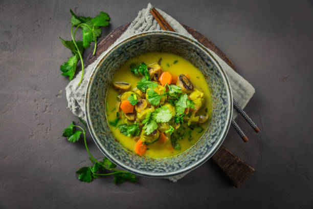 istock Green curry vegetable soup with Brussel sprouts, mushrooms and cilantro 2176314186