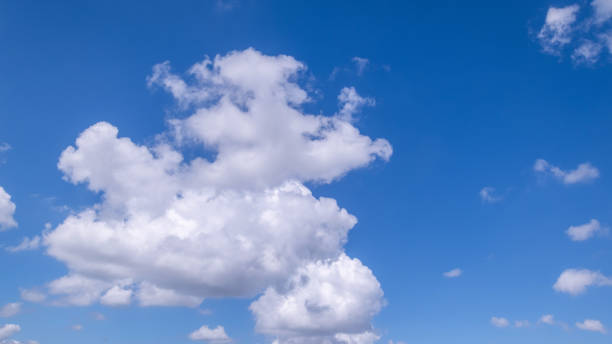 istock Panoramic view of clear blue sky and clouds, Blue sky background with tiny clouds. White fluffy clouds in the blue sky. Captivating stock photo featuring the mesmerizing beauty of the sky and clouds. 2176314466