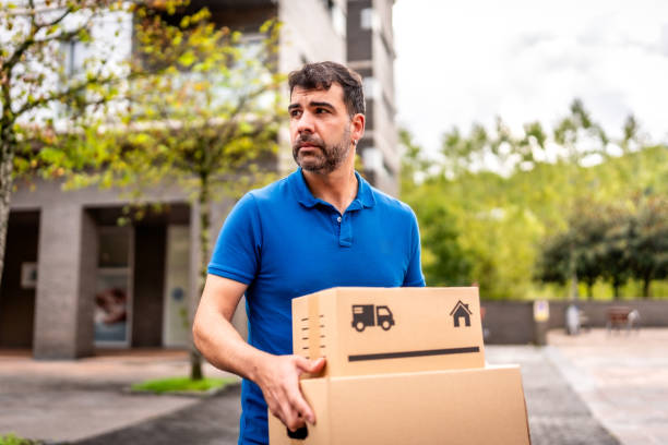 istock A courier delivering parcels along the city 2176315952