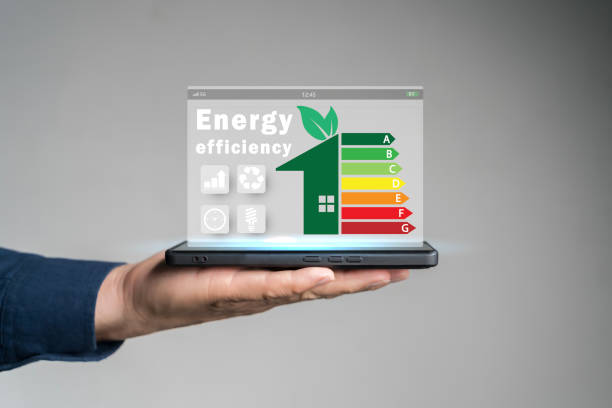 istock Energy efficiency concept. Person using tablet with energy efficiency rating icon on virtual screen for energy efficient house. 2176318525