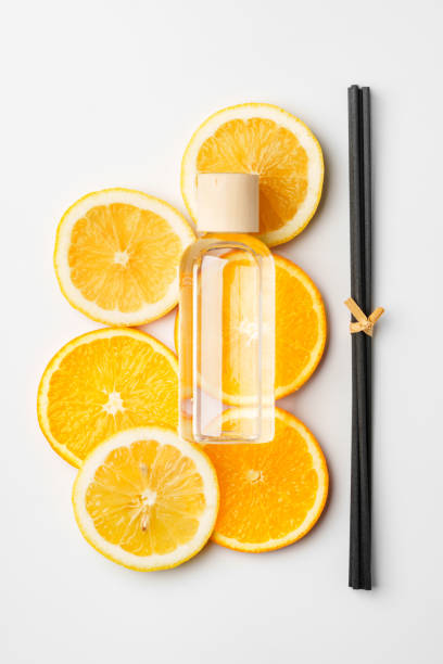 istock Aromatic display of essential oils with citrus fruit and chopsticks on a minimalist background 2176323686