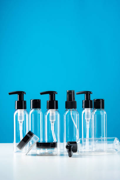istock Plastic bottles with black caps are neatly arranged on blue background 2176324215
