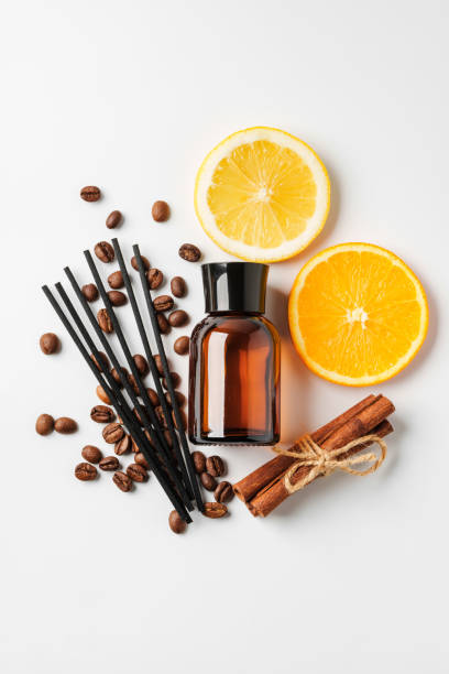 istock Aromatic display of citrus fruits, coffee beans, cinnamon sticks, and diffuser on a clean white surface 2176324219