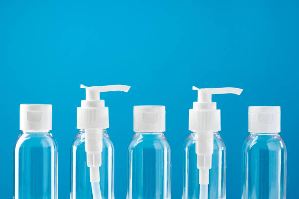 istock Clear plastic bottles with pumps arranged on a table against a bright blue background 2176324286