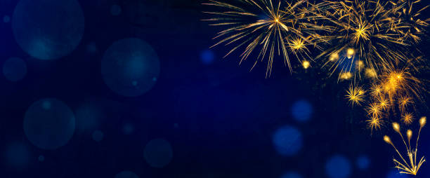 istock Golden fireworks burst on blue texture background with copy space 2176326597