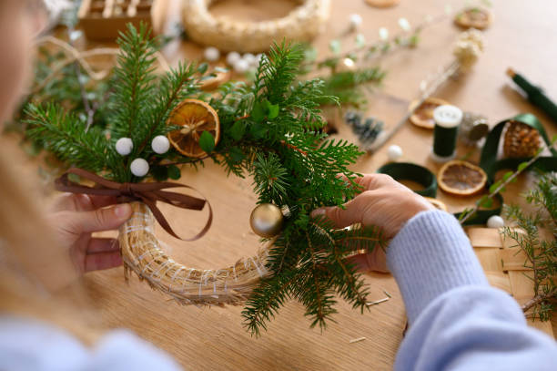 istock Natural Christmas wreath in progress on a crafting table 2176326685