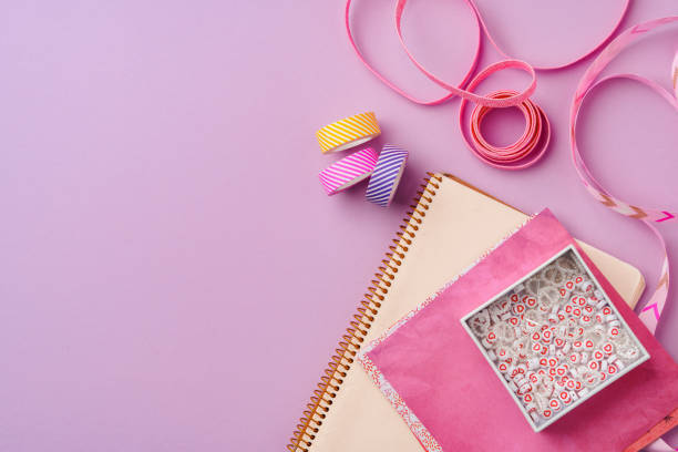 istock Crafting supplies on a purple background ready for creative projects 2176327576