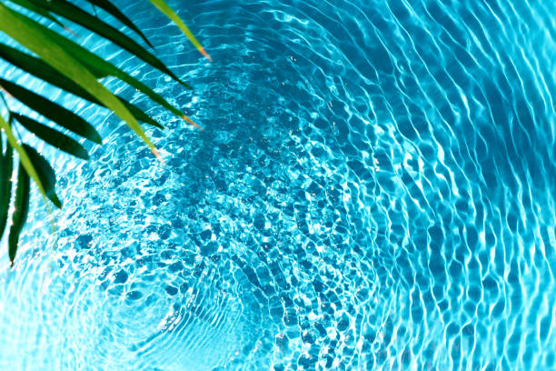 istock Clear turquoise pool water glistens under sunlight with gentle ripples 2176328755
