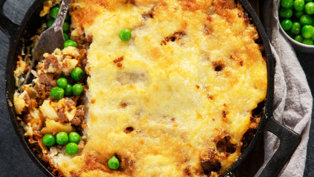 istock Shepherds Pie - ground meat with vegetables, topped with mashed potatoes, and cheese. Baked. 2176332403