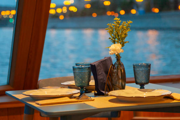 istock Served table in street cafe on blurred background with bokeh 2176336037
